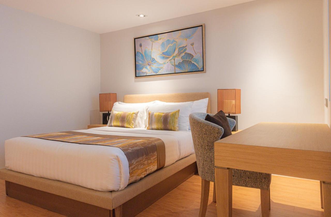 Summit Windmill Golf Suite Hotel At Suvarnabhumi Banguecoque Exterior foto A bedroom at the hotel